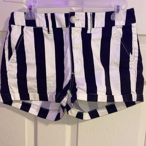 black and cream/white, striped shorts